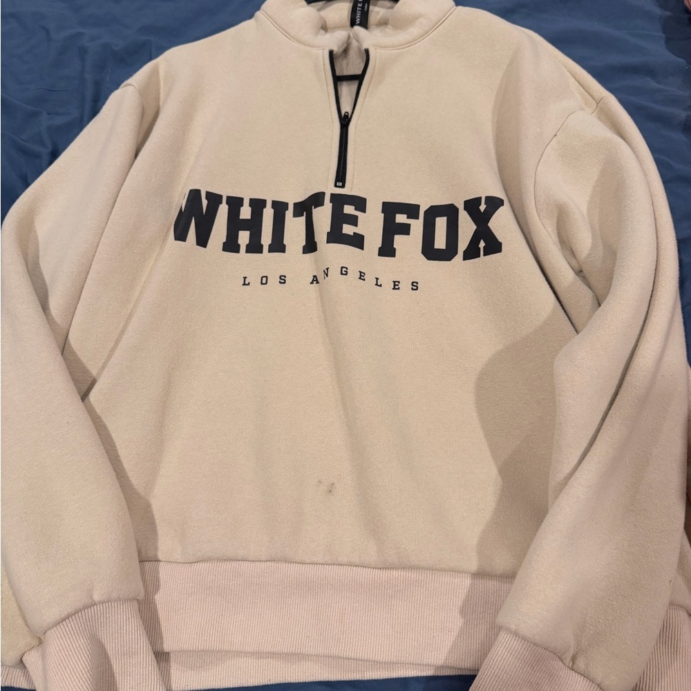 White fox crew neck.